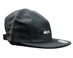 Black five panel hat with black and white American Alpine Club embroidered logo patch