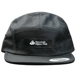 Black five panel hat with black and white American Alpine Club embroidered logo patch